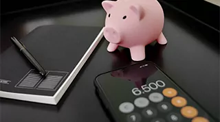 Immobilienkredit Rechner mit Sparschwein